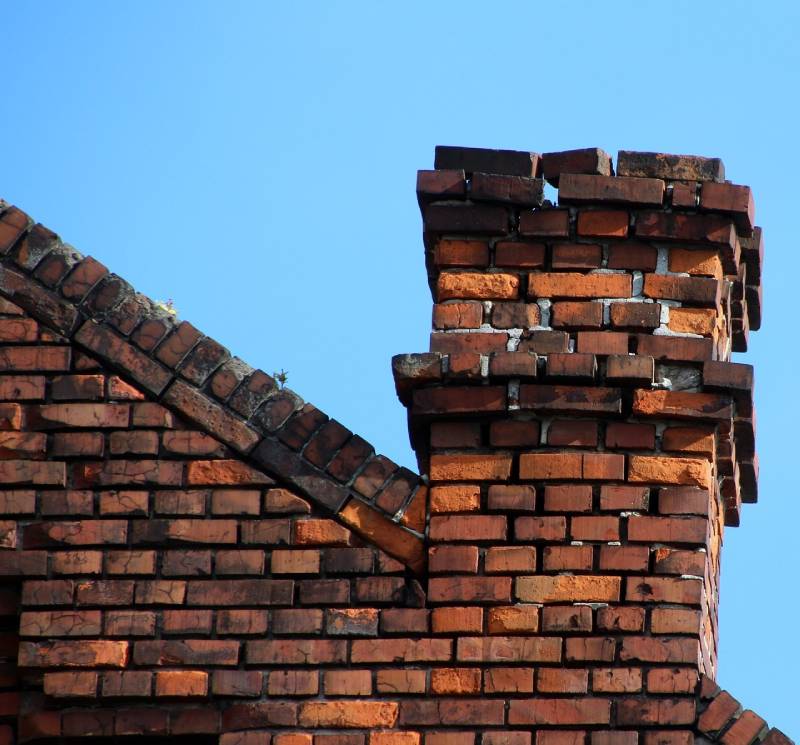 Signs Your Imperial Beach Home Needs a Chimney Inspection Damaged chimney on an Imperial Beach home showing cracks and missing mortar